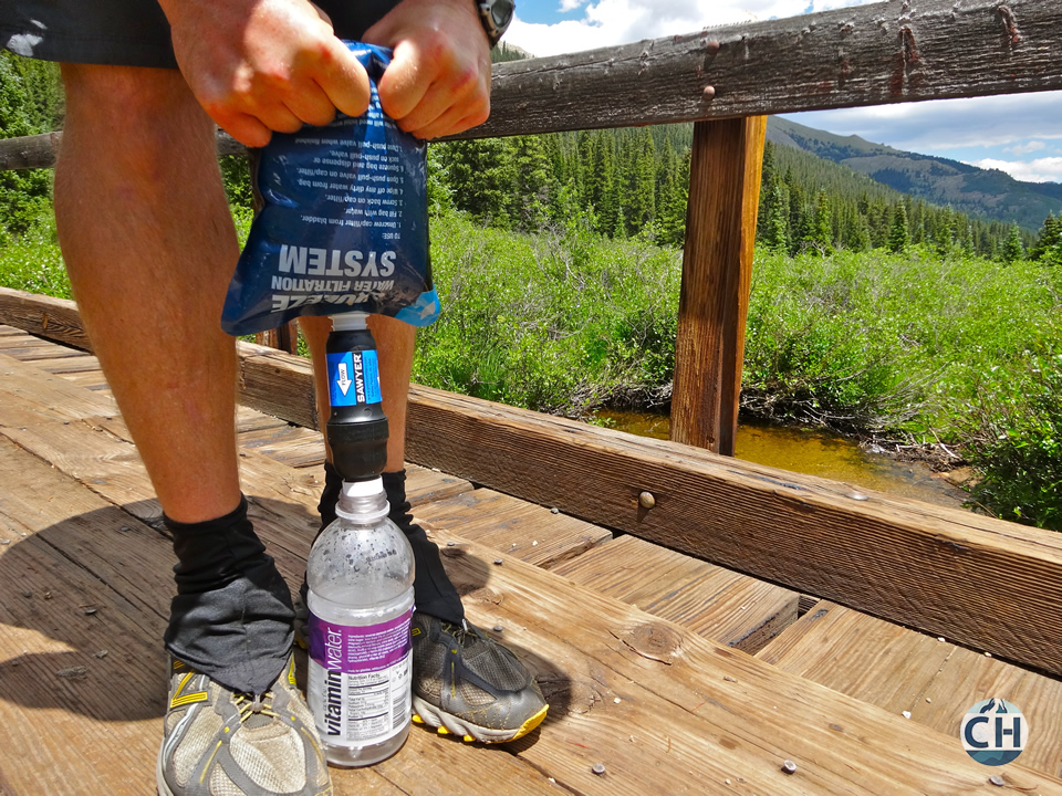 Squeezing water into bottle