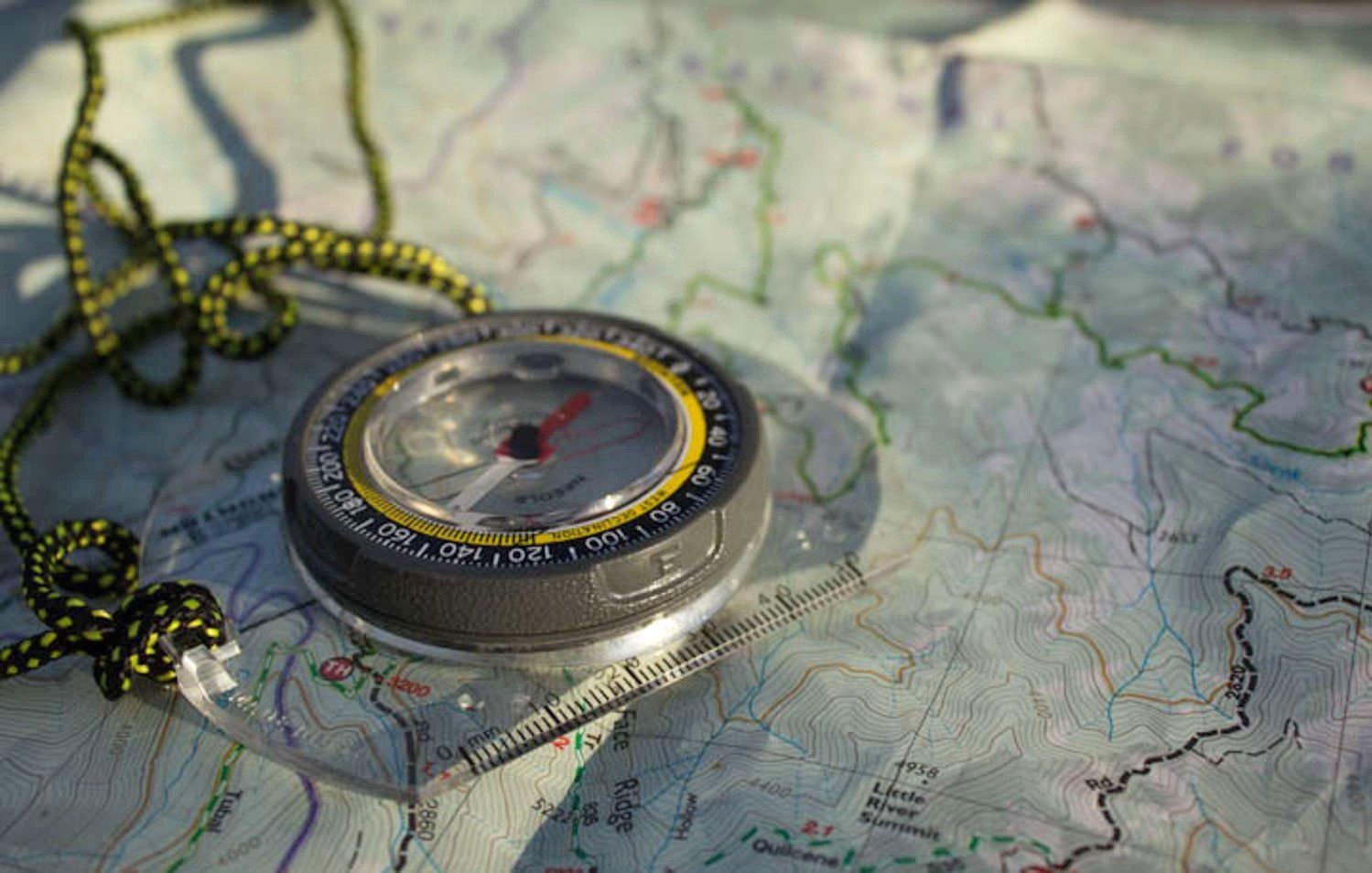 Closeup of a map and compass