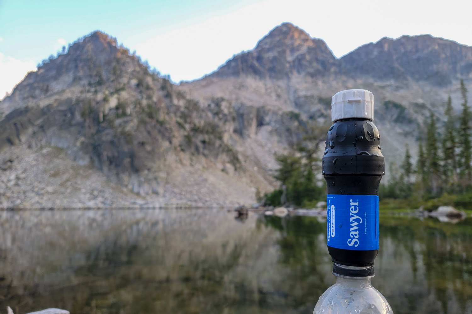 The Sawyer Squeeze Water Filter in front of granite peaks in the Wallowas.