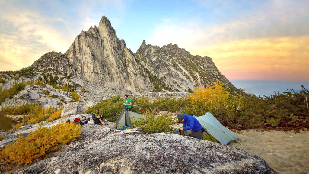 The Zpacks Duplex and Tarptent Motrail ultralight backpacking tents in front of a jagged mountain peak at sunset
