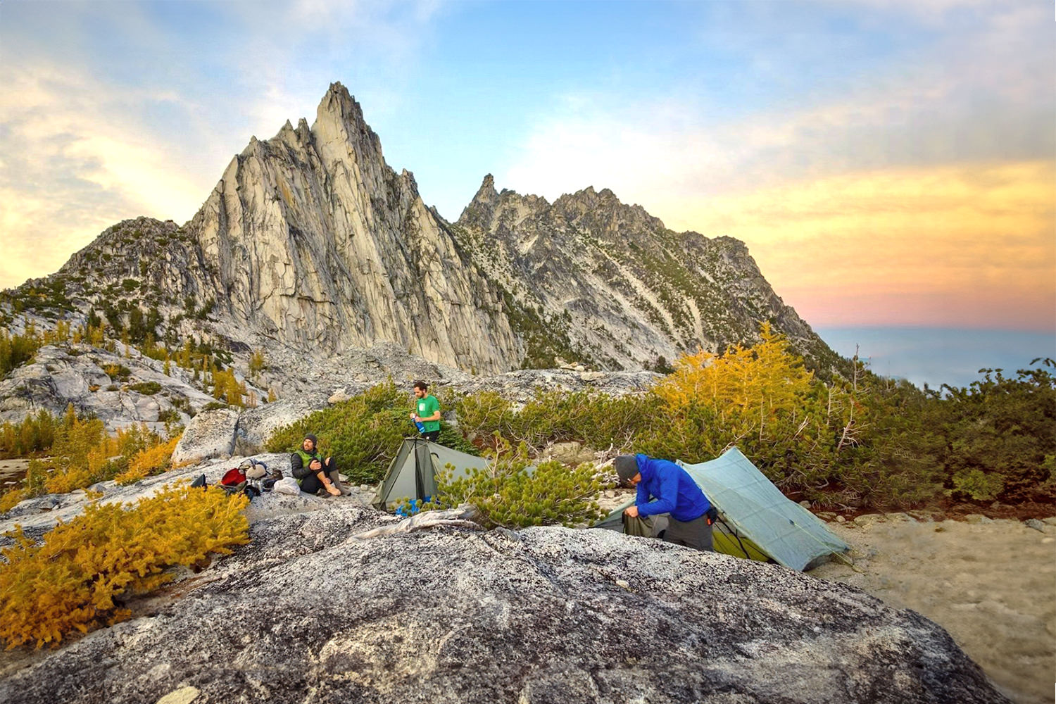 The Zpacks Duplex and Tarptent Motrail ultralight backpacking tents in front of a jagged mountain peak at sunset
