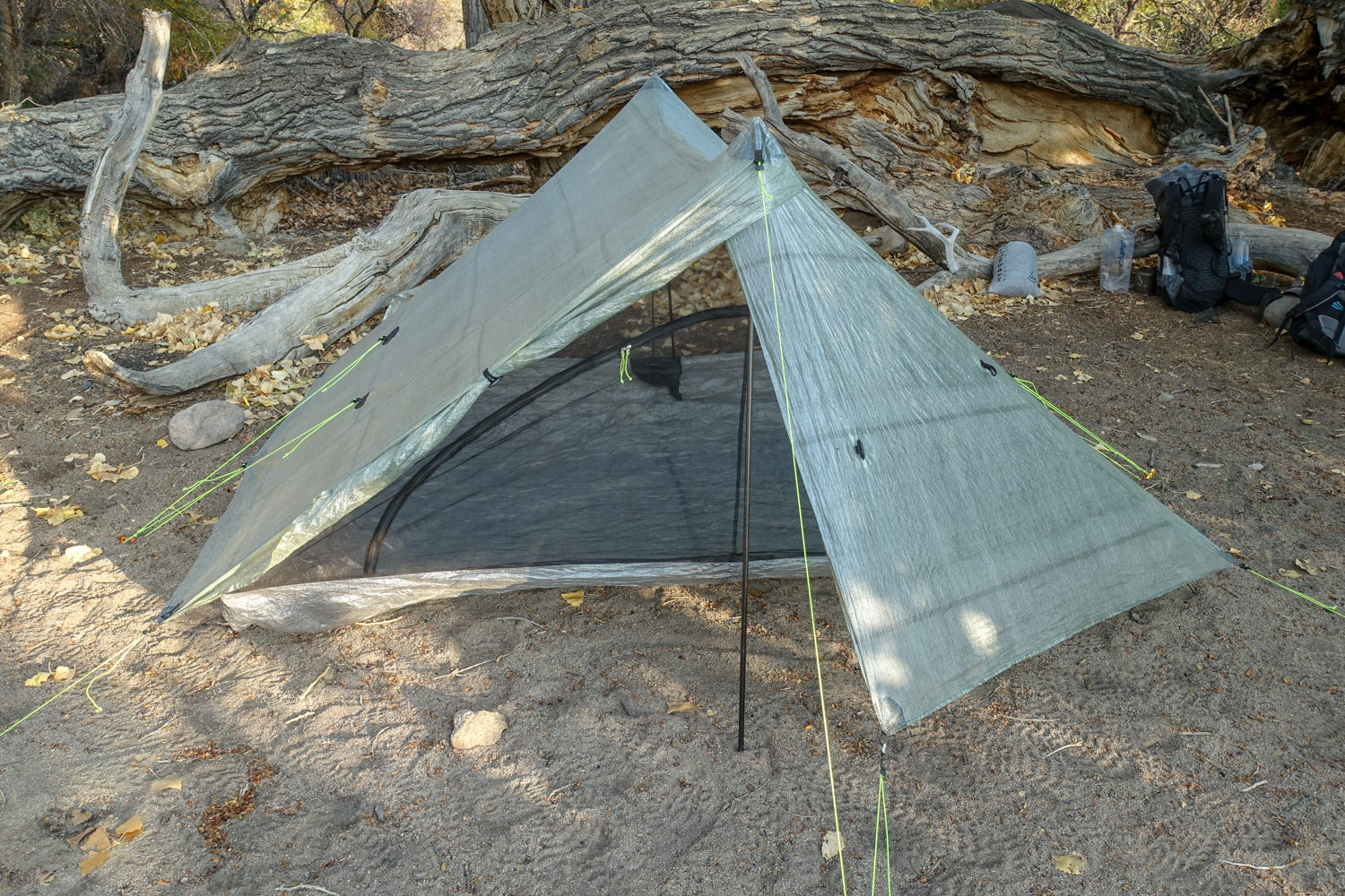 storm door rolled back and the zpacks triplex classic set up in camp
