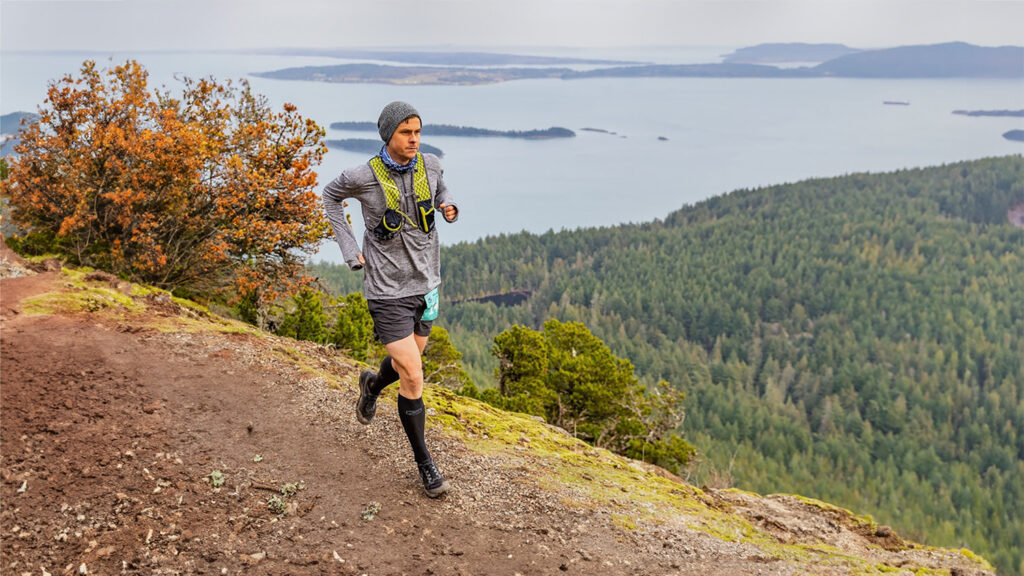 A marathon runner in an Ultimate Directions running vest