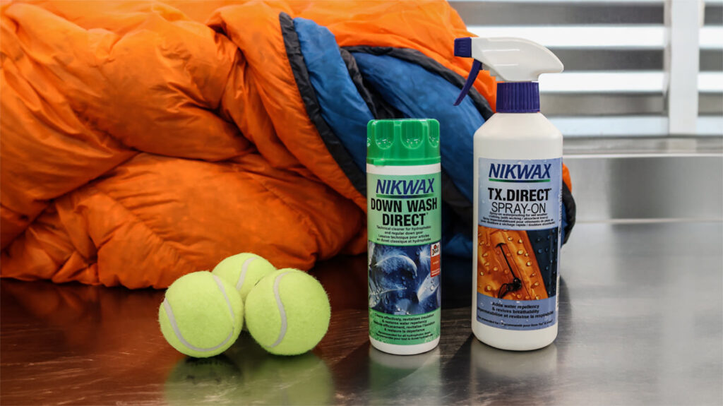 Nikwax Down Wash Direct and Tx. Direct Spray-On Waterproofing with tennis balls and a Feathered Friends down sleeping bag