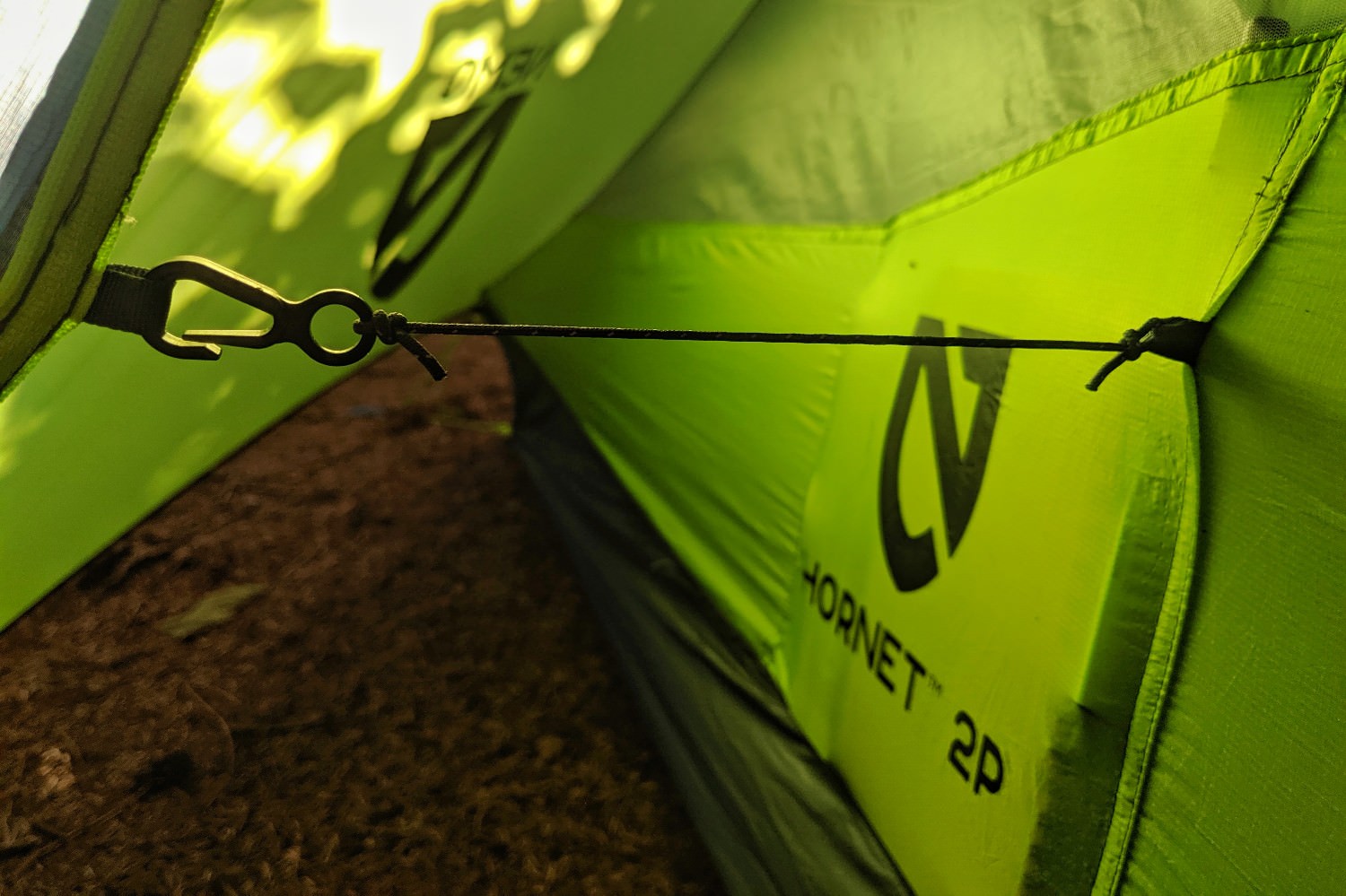 a clip attaching the tent walls to th rainfly provide more space by preventing the walls from sagging when pockets are full.