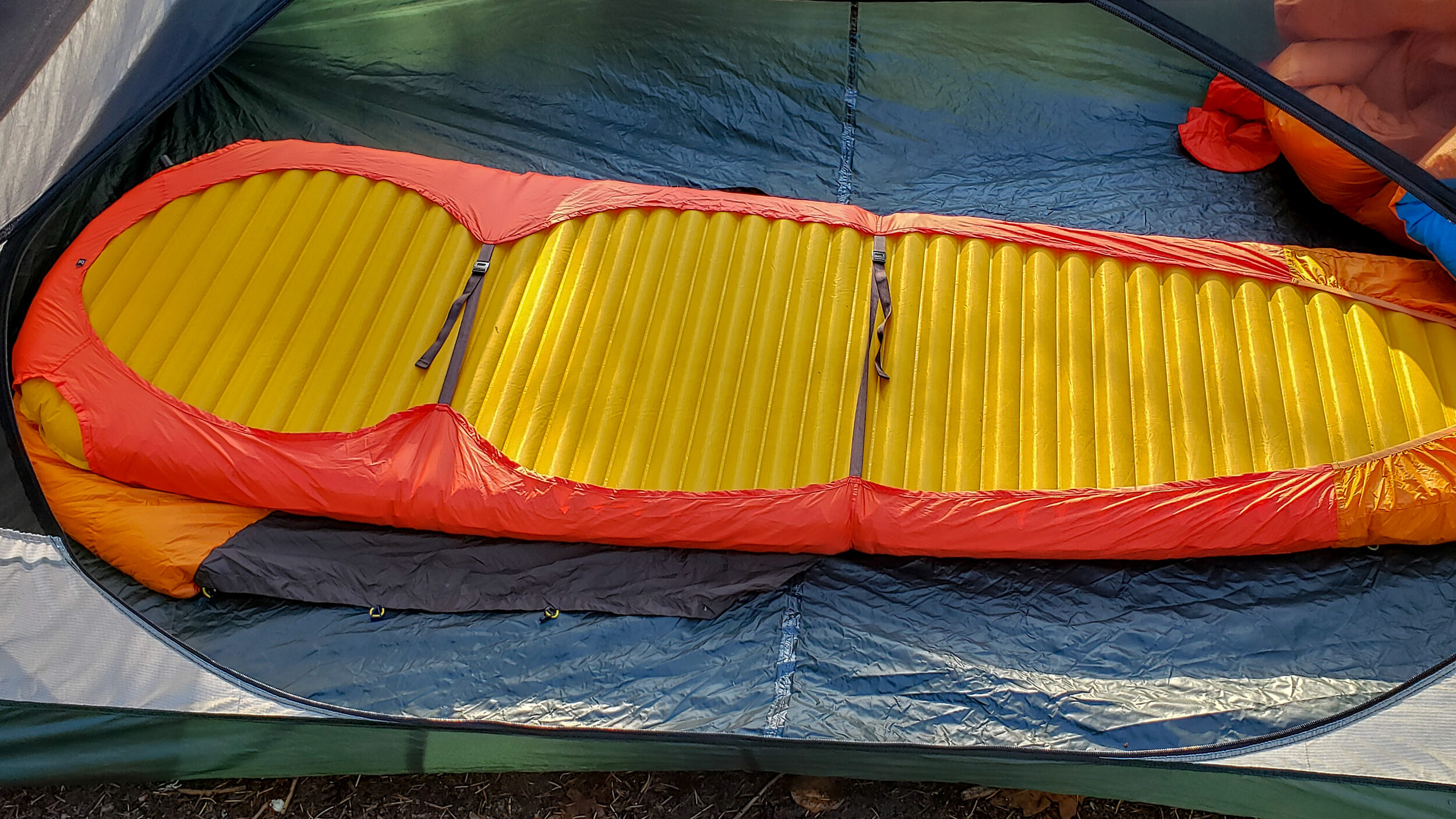 Underside view of how the zenbivy sheet attaches to a sleeping pad