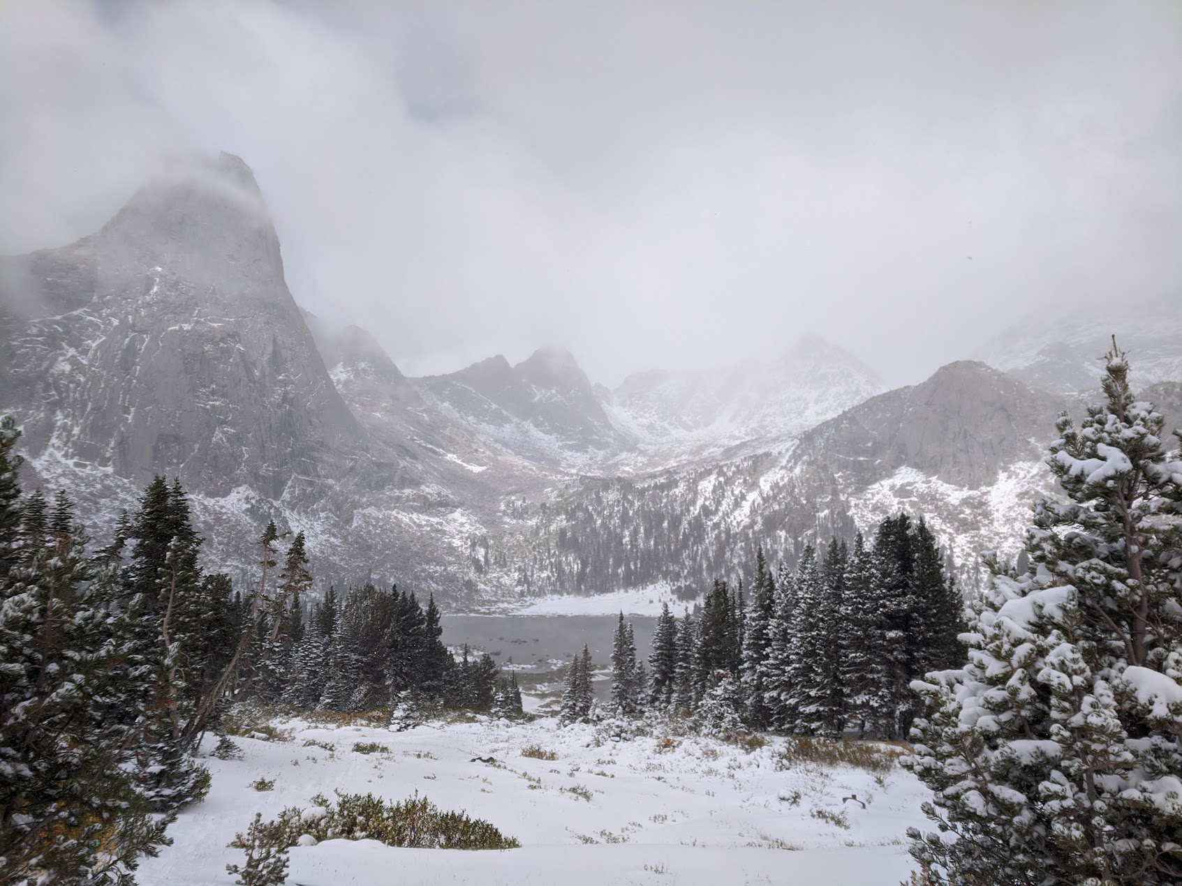 a stormy snowy mountain scene in the cirque of the towers in the wind river range
