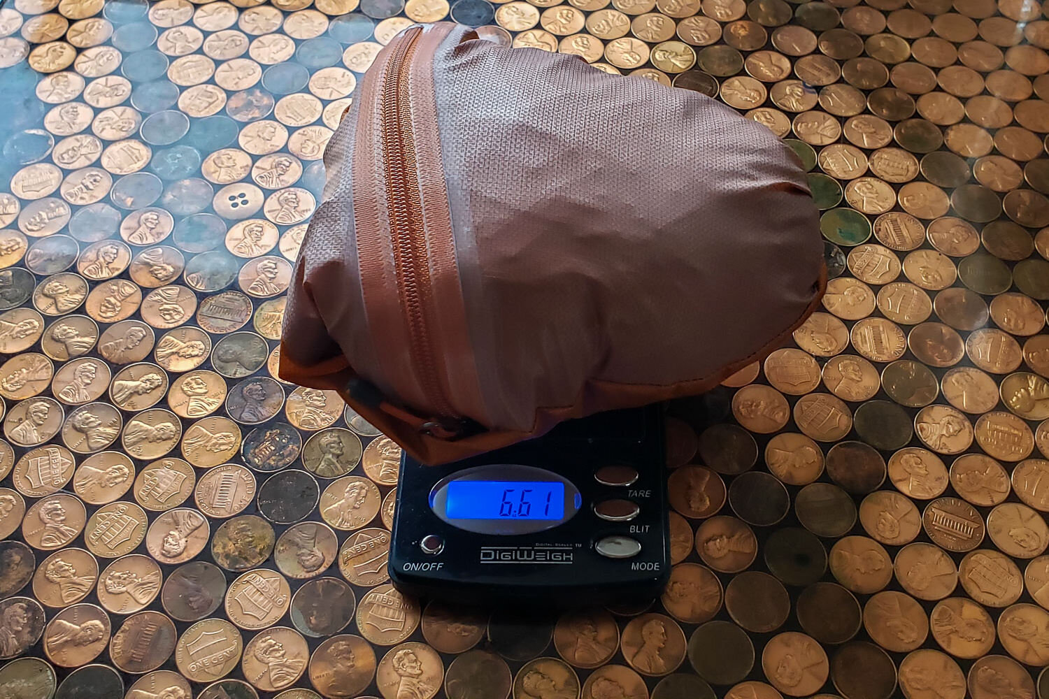 Measuring the actual weight of the men’s large Helium jacket (only 6.6 oz.)