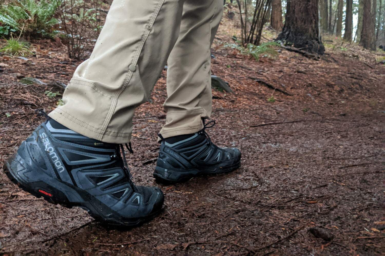 Wearing one of our top pick boots, the Salomon X Ultra 3 Mid GTX, during a soggy day hike