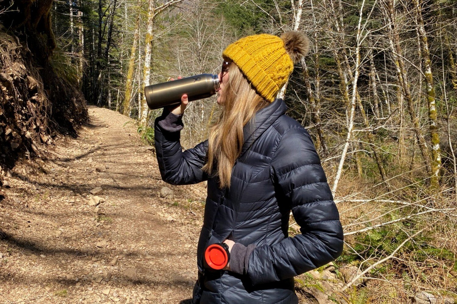 Drinking from the Hydro Flask Lightweight Trail Series Wide Mouth Vacuum Insulated Water Bottles on a dayhike in cold weather.jpeg