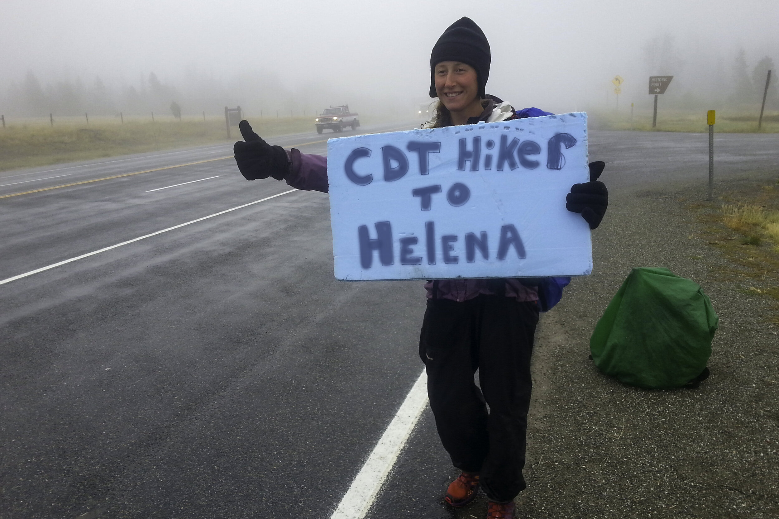 Making a sign is helpful when trying to hitchhike