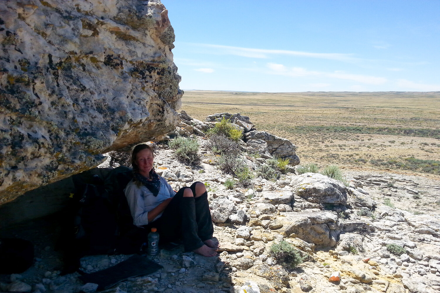 Sitting in the shade of a large boulder to be the mid-afternoon Heat in Wyoming