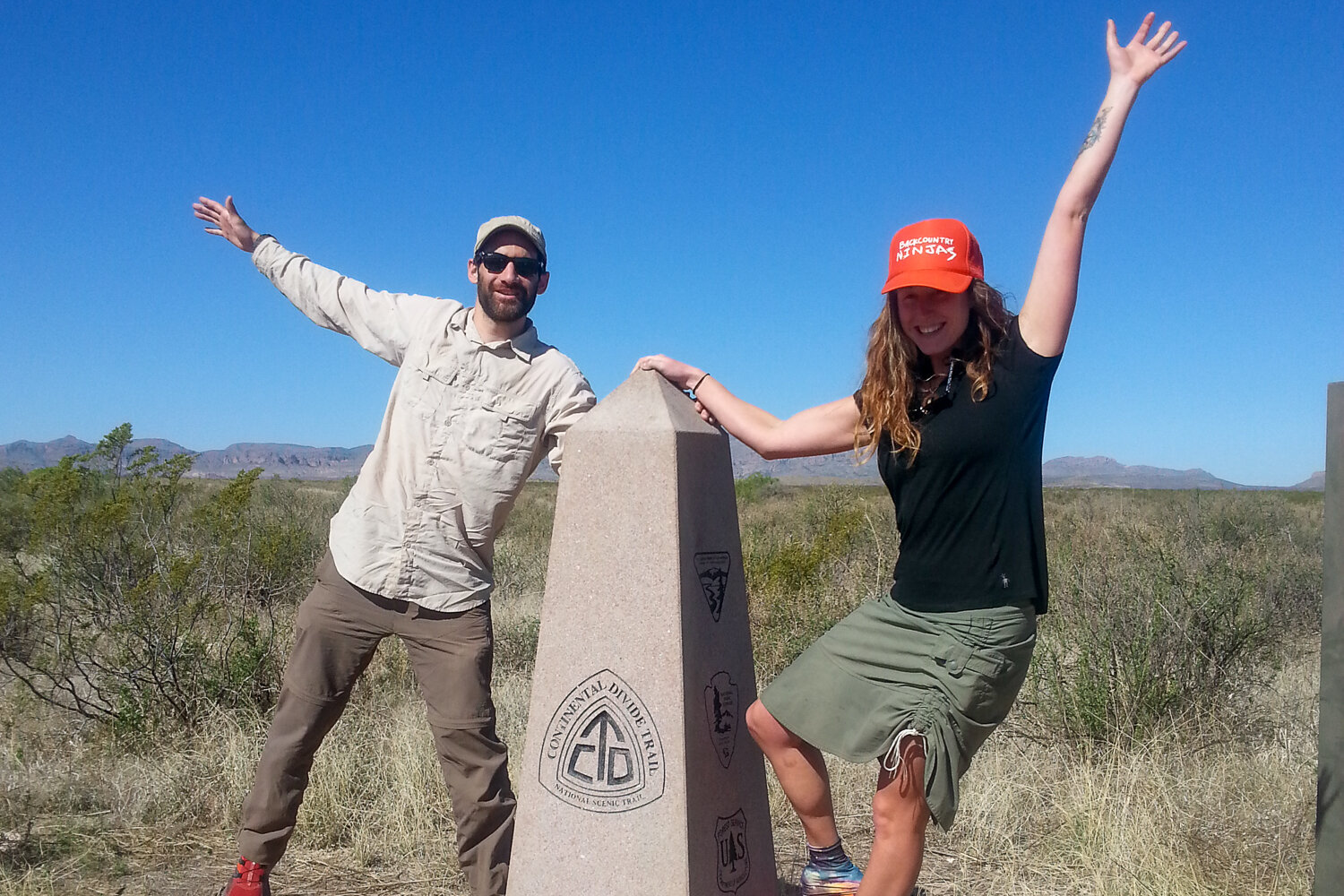 posing for a photo at the CDT's Southern Terminus Monument