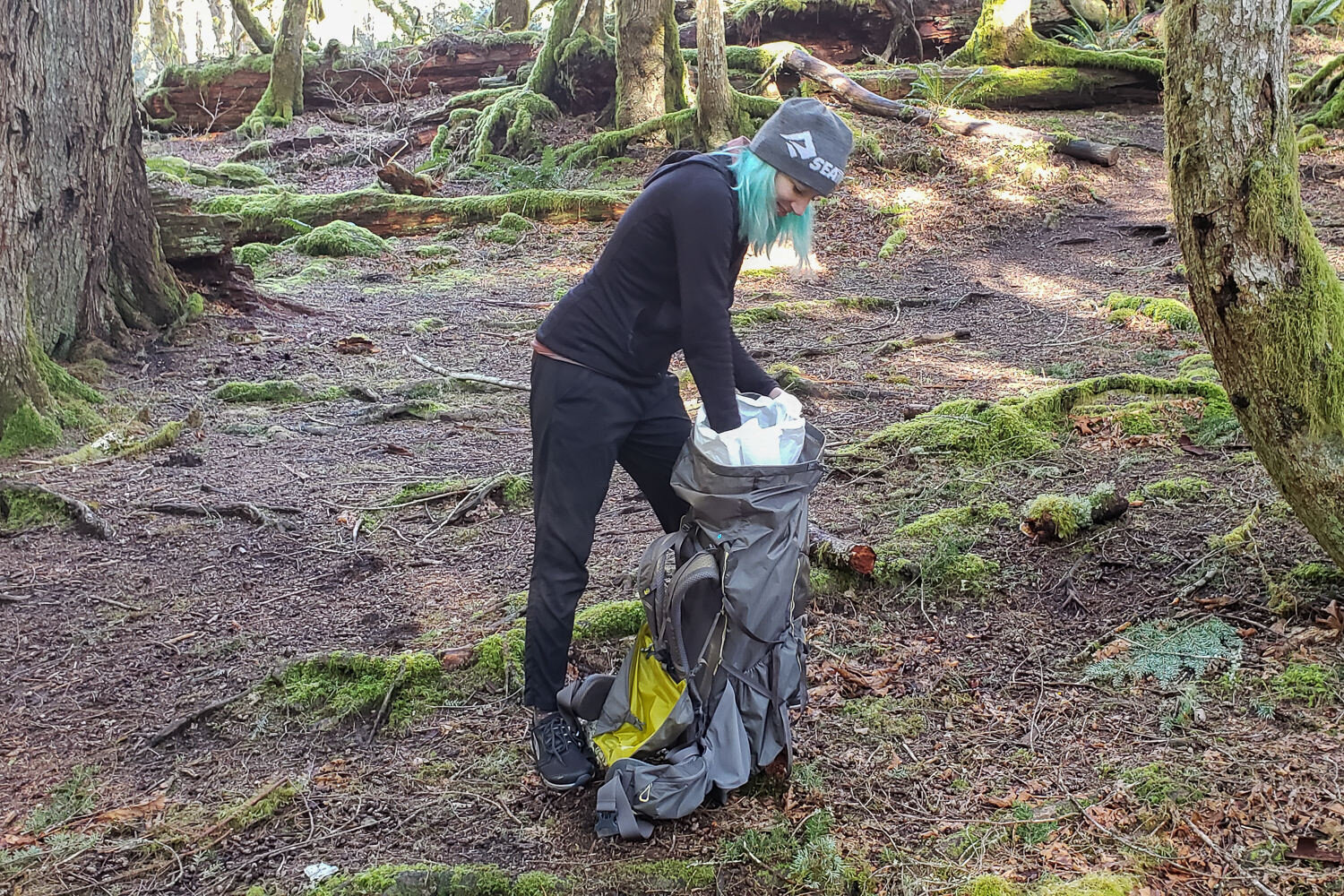 A trash compactor bag makes an inexpensive & effective backpack liner to protect your gear from the elements.