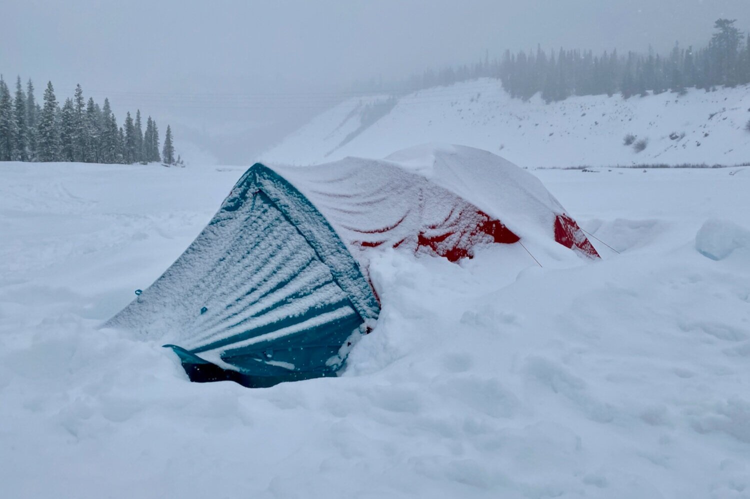 the Mountain Hardwear Trango 2 is a bit heavy & has less headroom, but it’s strength & weather protection are excellent for winter trips.