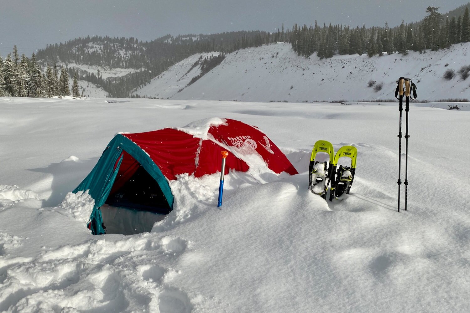 https://www.cleverhiker.com/wp-content/uploads/2021/01/The-Mountain-Hardwear-Trango-2-tent-covered-in-snow-on-a-winter-camping-trip.jpeg