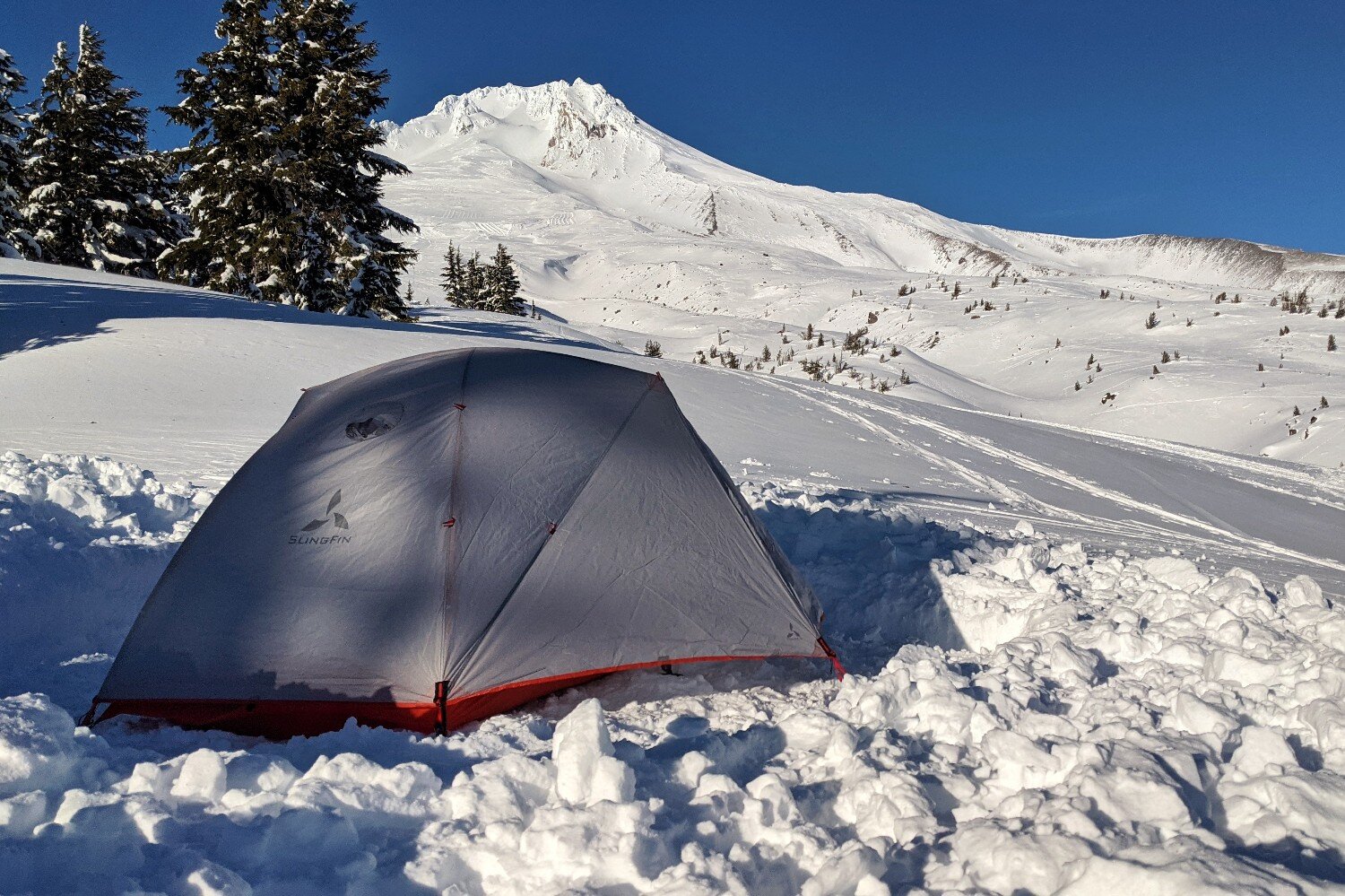 The Slingfin Crossbow 4-season tent in front of a snowy mountain