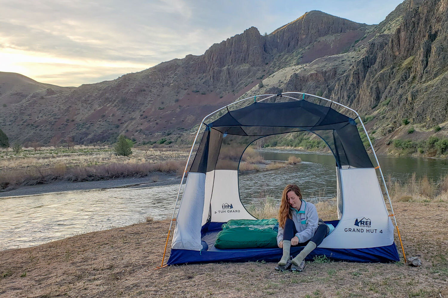 The REI Grand Hut 4 is one of our favorite camping tents because it’s easy to set up, tall enough to stand in, and hold up well to bad weather