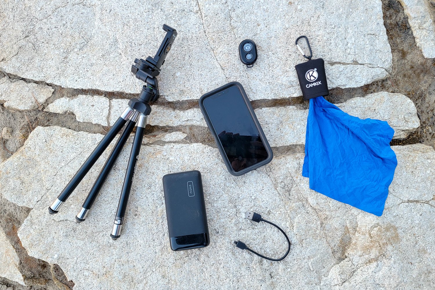 Top-down view of photography gear for backpacking