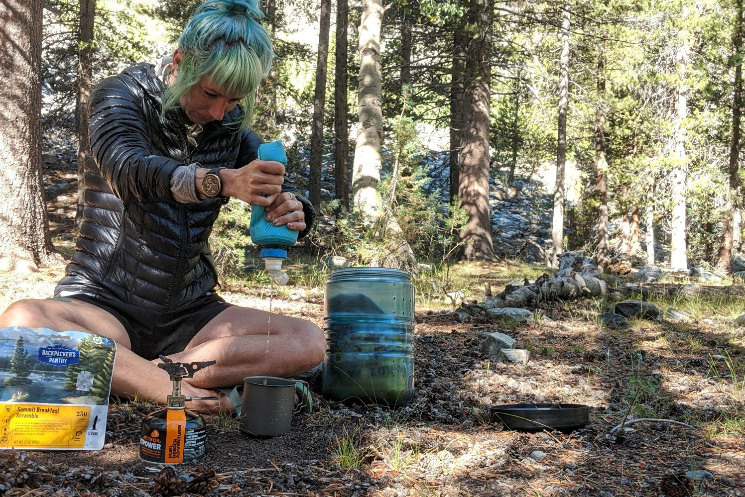 https://www.cleverhiker.com/wp-content/uploads/2021/10/A-hiker-squeezing-water-from-the-Katadyn-BeFree-filter-into-a-cookpot-at-a-campsite.jpeg