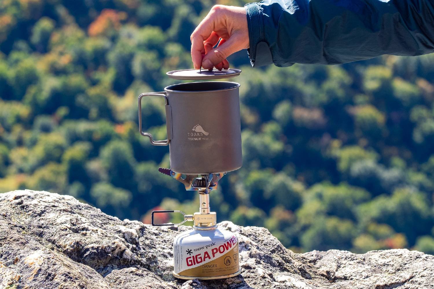 A close-up of the Snow Peak Litemax stove with the Toaks 750 mL pot on top