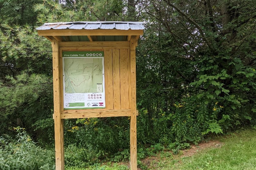 A trailhead sign for the Pine Cobble Trail