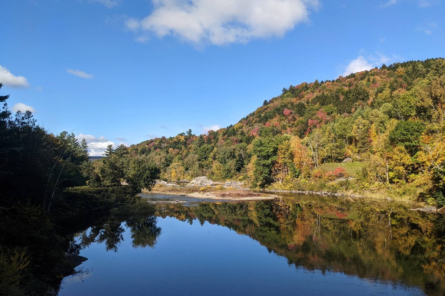 The sky and a mountain reflecting in a pond on the Long Trail