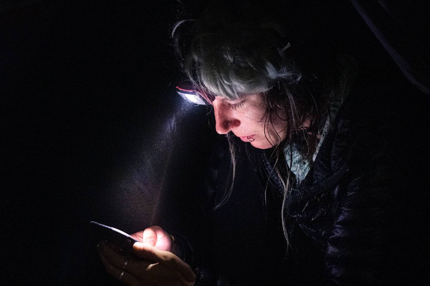 A hiker wearing the Black Diamond Spot 350 headlamp