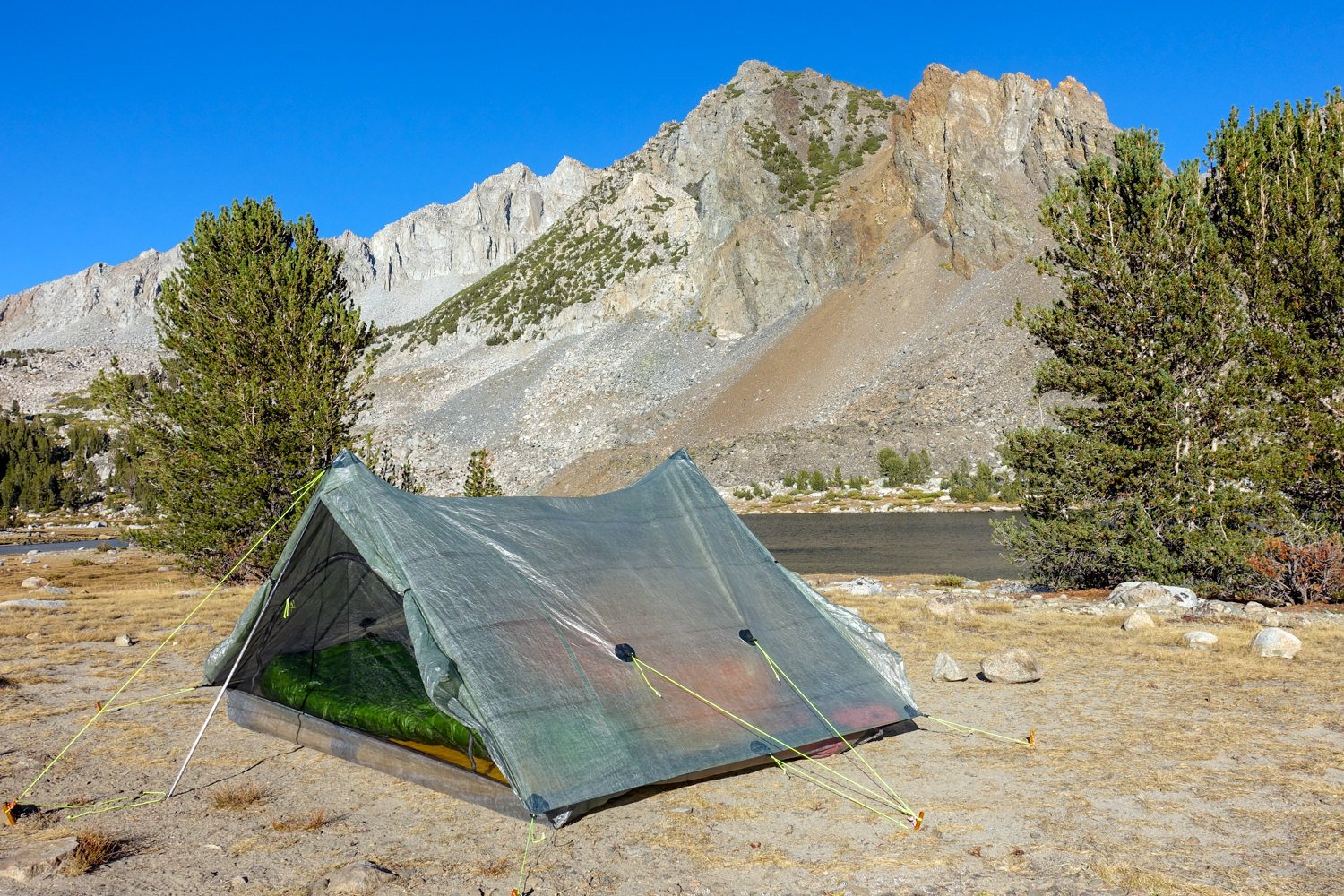 The Zpacks Triplex set up in front of a mountain view