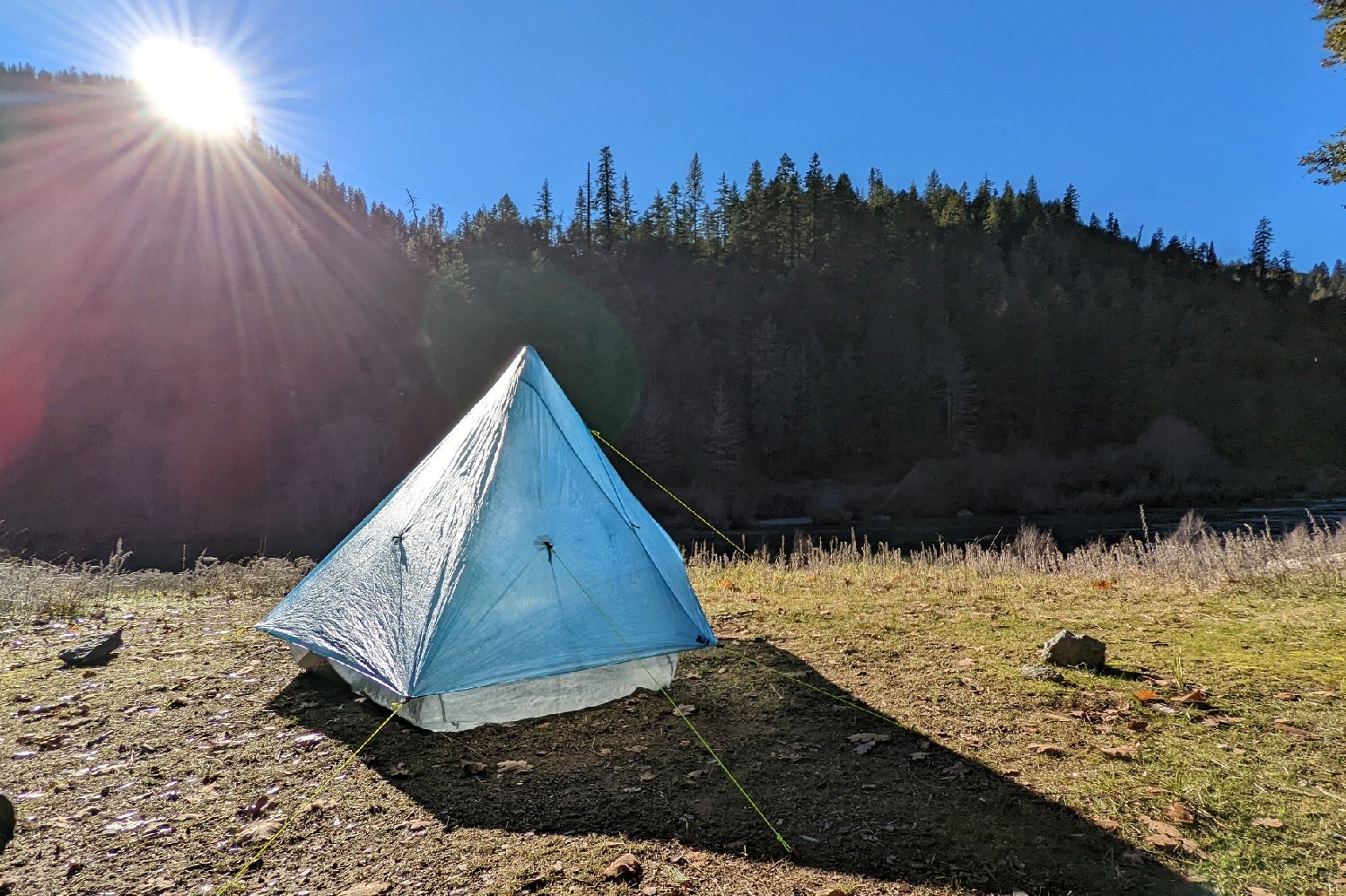 A side view of the Zpacks Plex Solo with all of its guyouts staked down