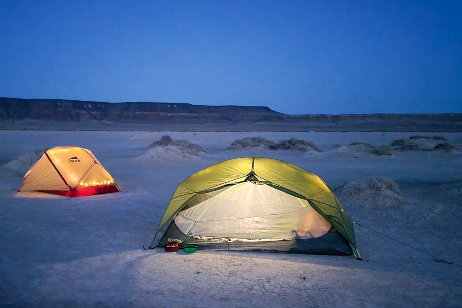 NEMO Dagger OSMO and MSR Hubba Hubba set up in the desert at night with lights inside