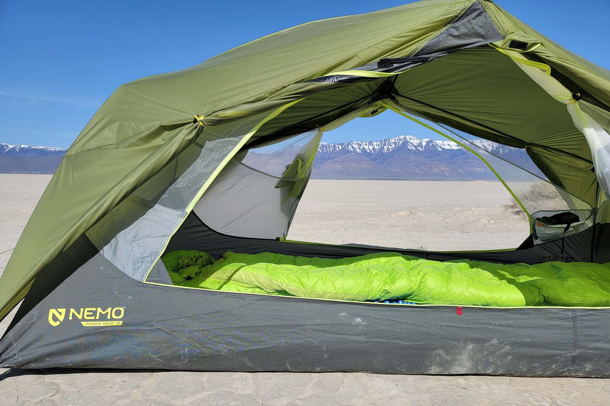 close up of the open doors of the NEMO Dagger OSMO with mountains in the background