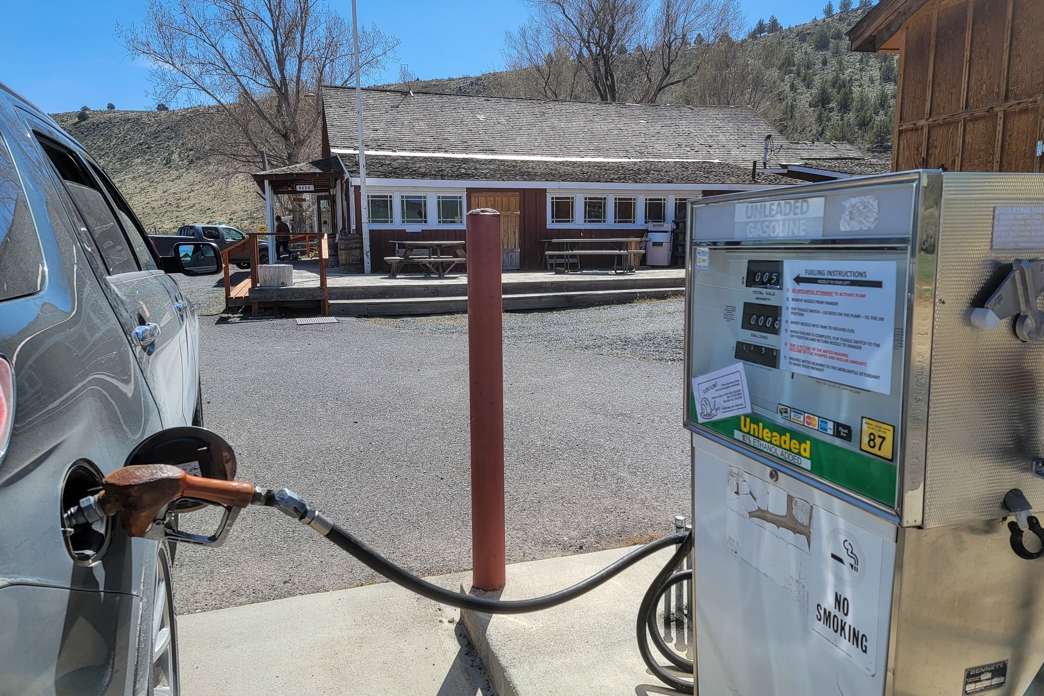 A car filling up at a small gas station in Frenchglen, Oregon