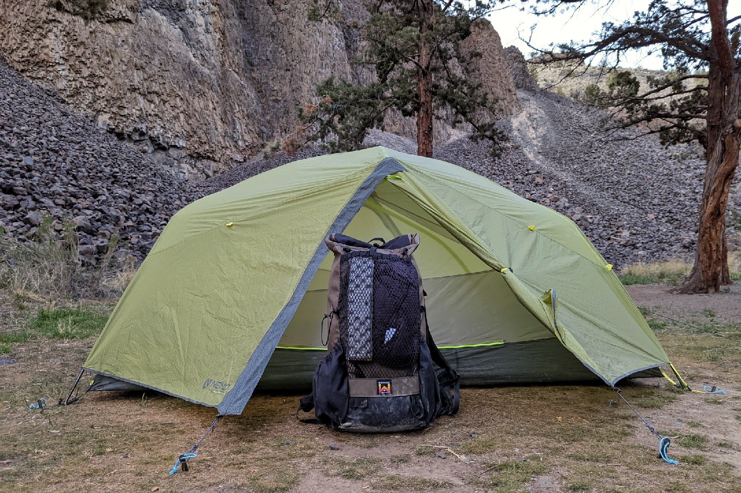 A backpack sitting in the vestibule of the NEMO Dagger OSMO 2