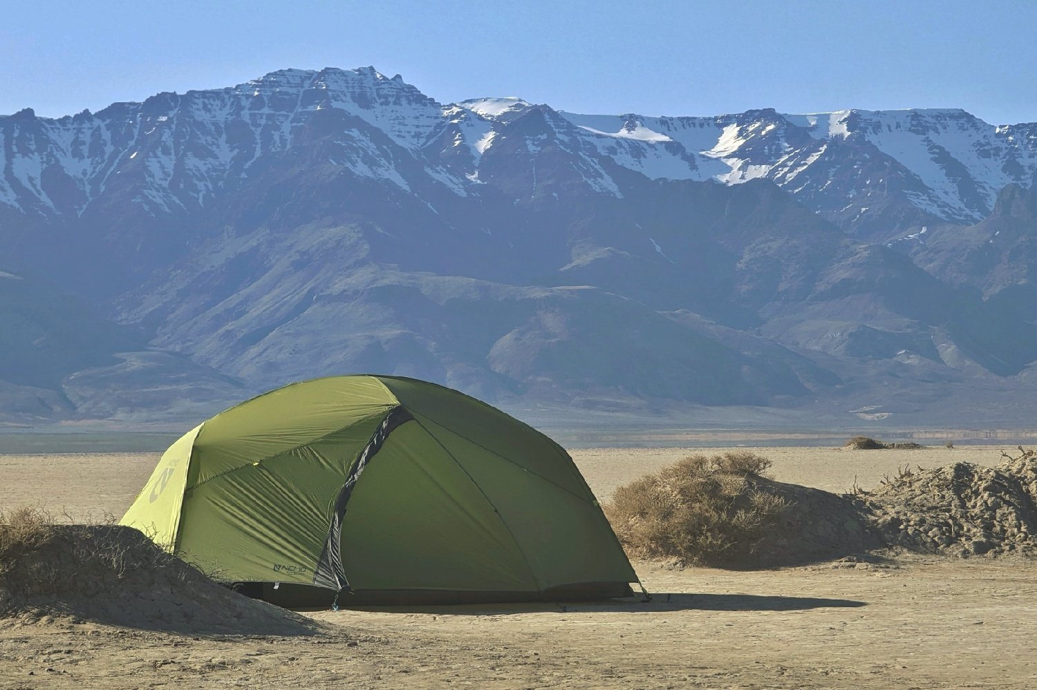 The NEMO Dagger OSMO set up in the desert with mountains in the background