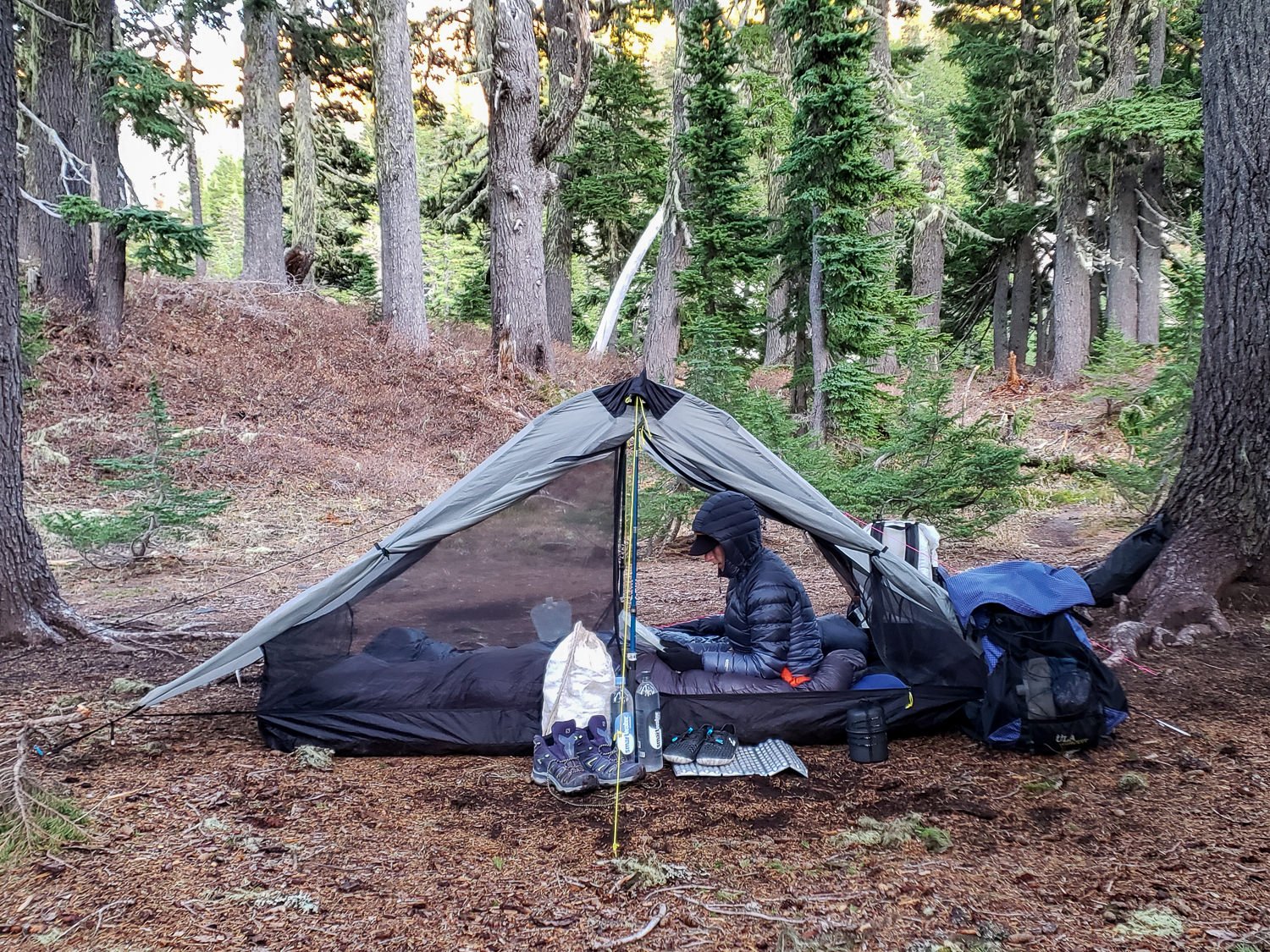 A backpacker using the Six Moon Designs Lunar Duo tent