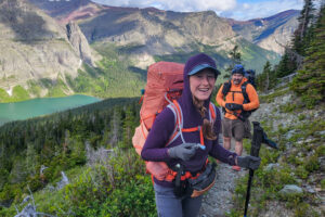 A backpacker using the HydraPak Contour hydration reservoir with the Deuter Aircontact Core 65+10 SL