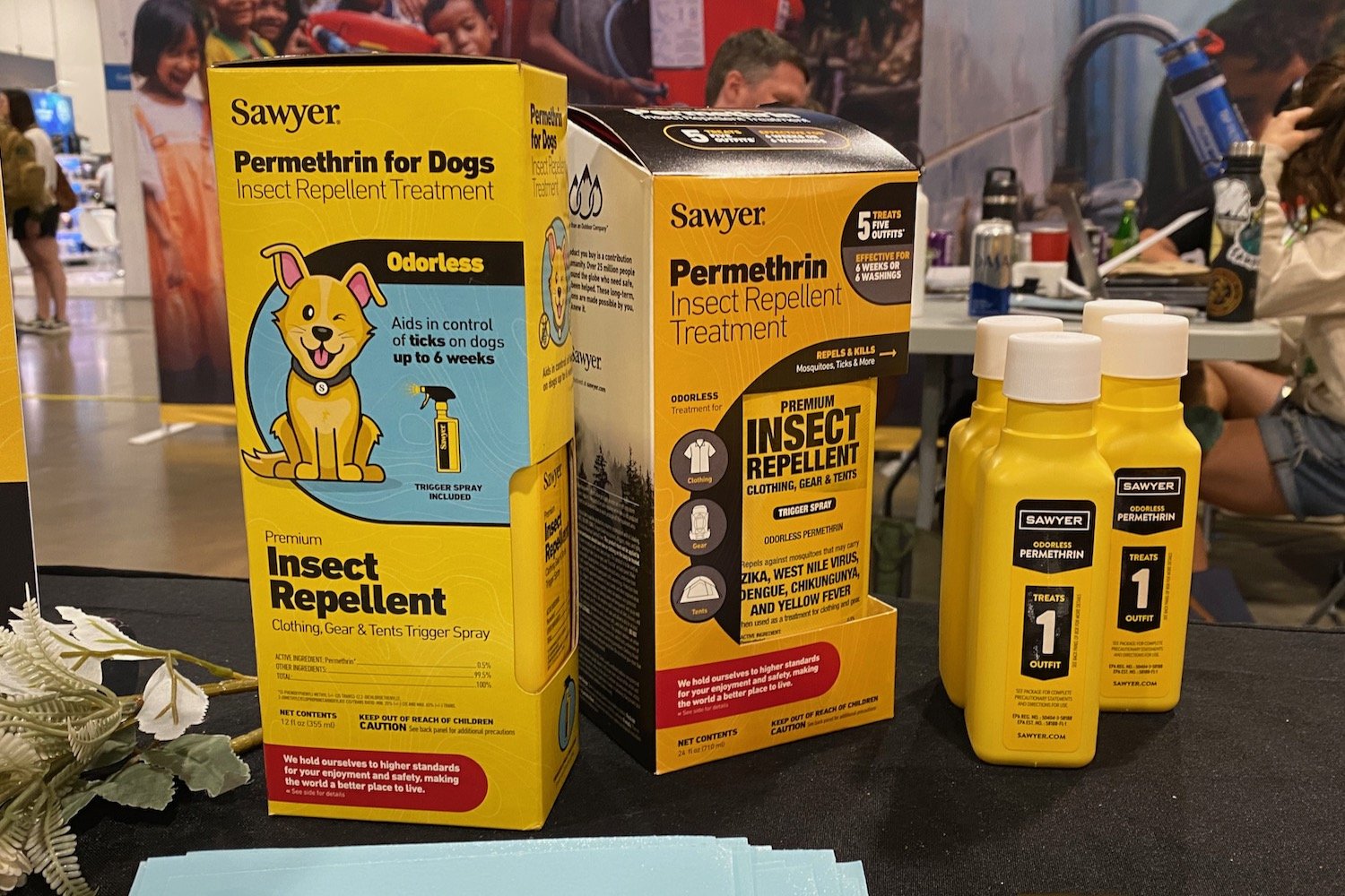 Bottles of Permethrin and Permethrin for Dogs sitting on a table
