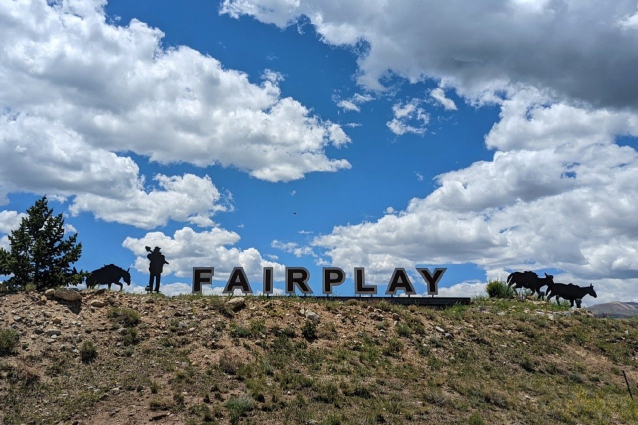 A sign welcoming you to the town of Fairplay Colorado