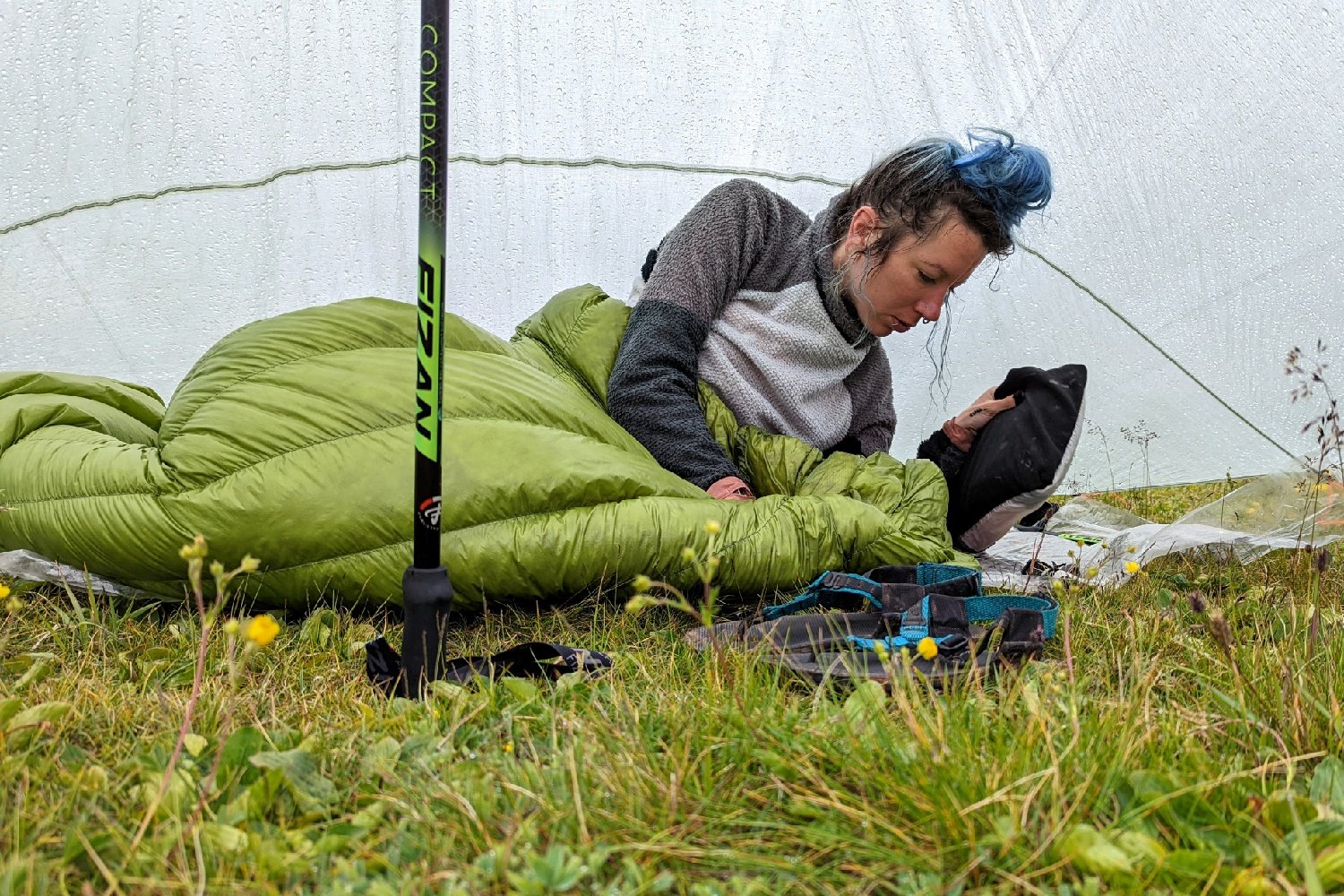 A person laying under a tarp in the Zpacks Classic Sleeping Bag