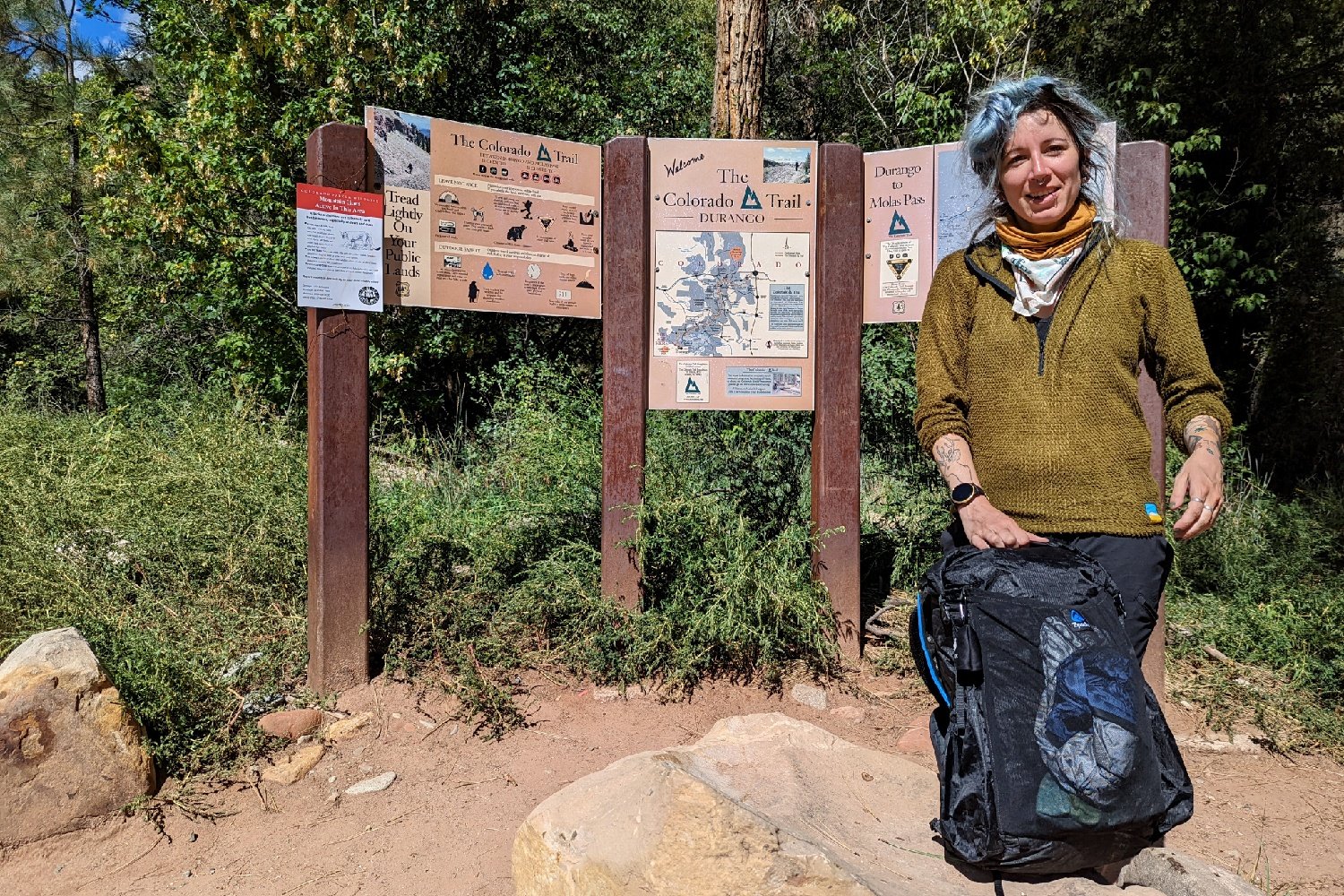A hiker at the southern terminus of the Colorado Trail