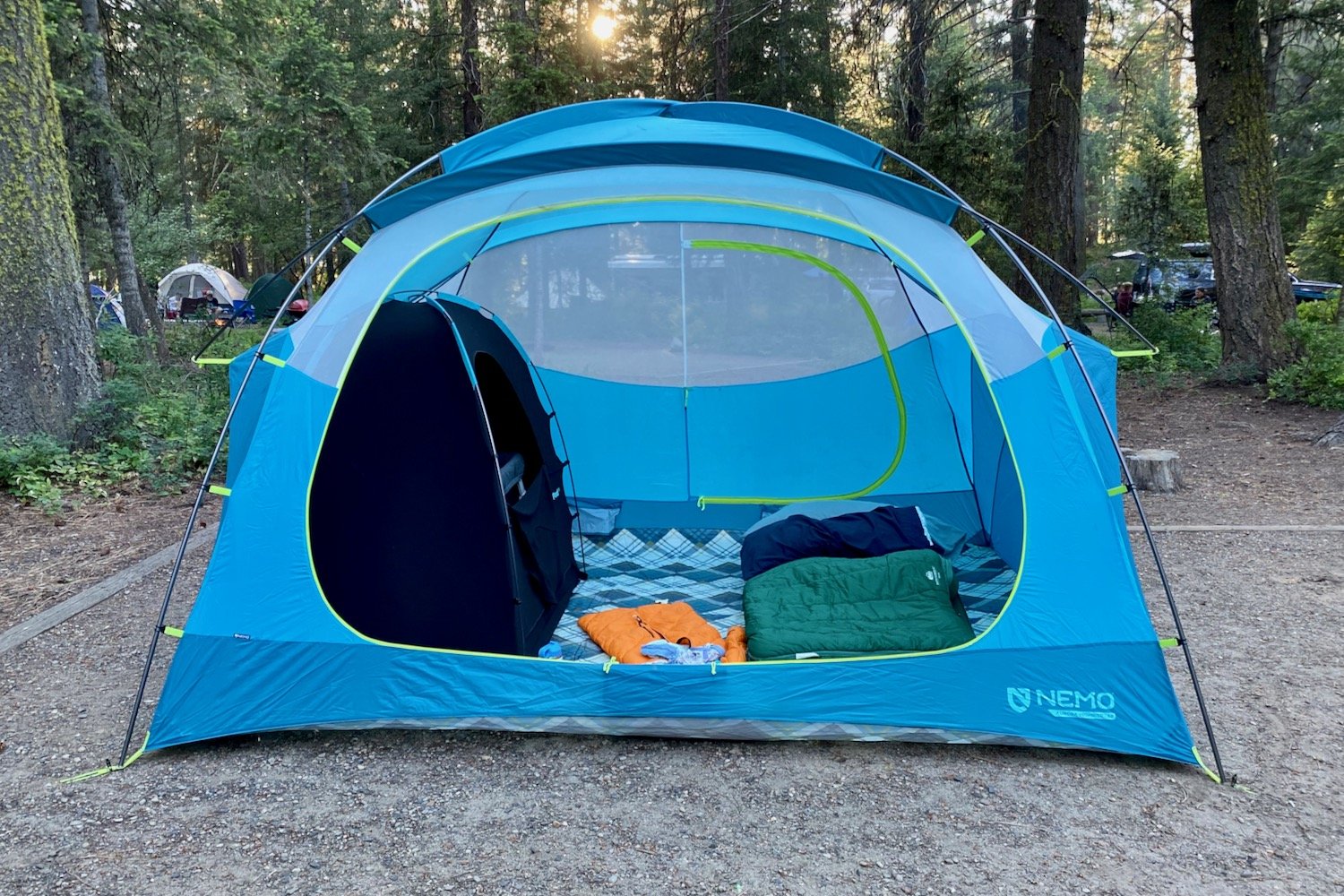 The 6P Nemo Aurora Highrise tent with a wide Exped Megamat 10 pad and a child's backout tent.
