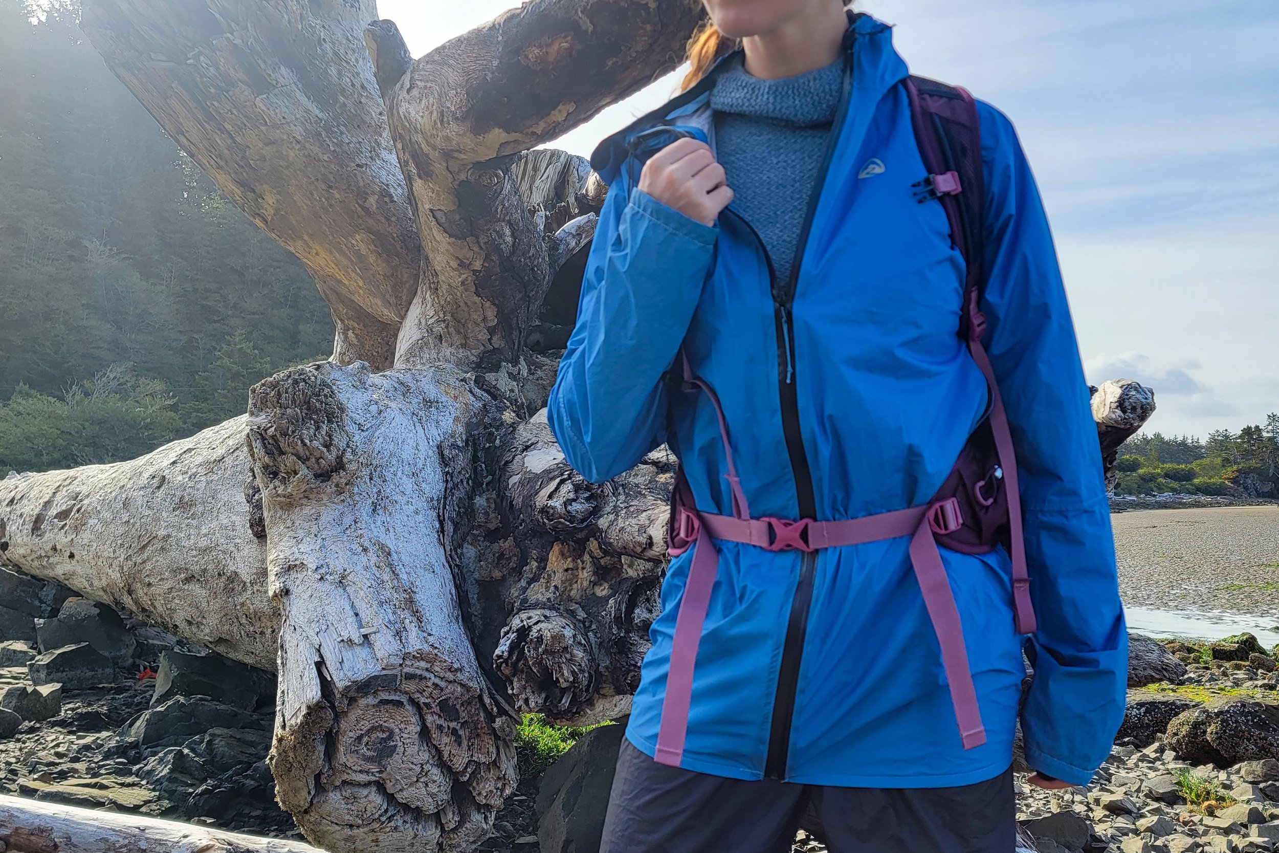 A hiker wearing the Zpacks Vertice Jacket with another layer underneath