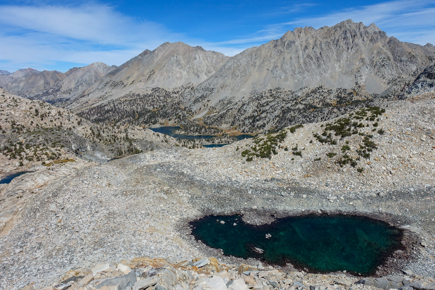 small lake below a mountain pass on the John Muir Trail.