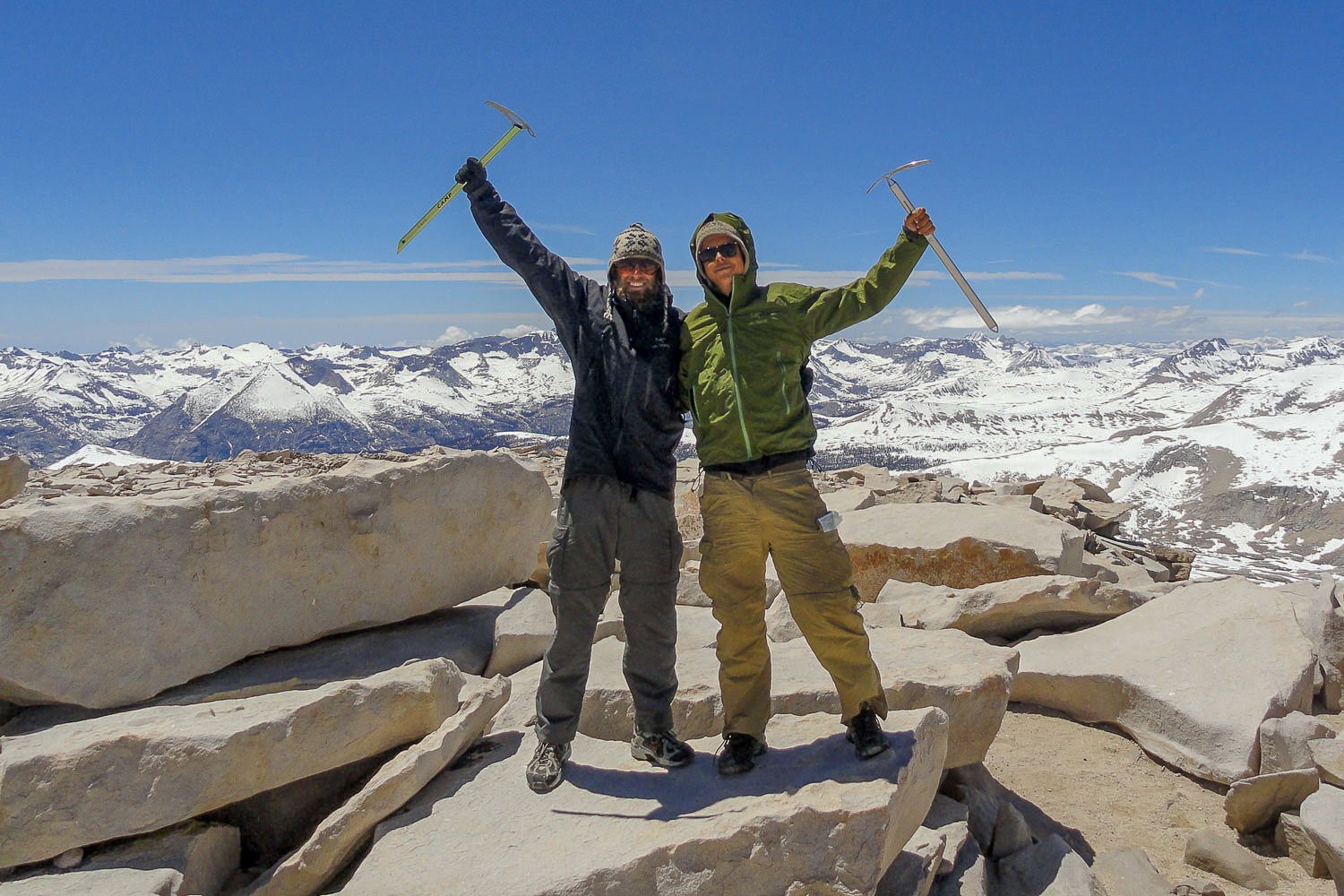 PCT thru-hikers posing on top of Mt. Whitney with C.A.M.P. Corsa and Black Diamond Ice Axes