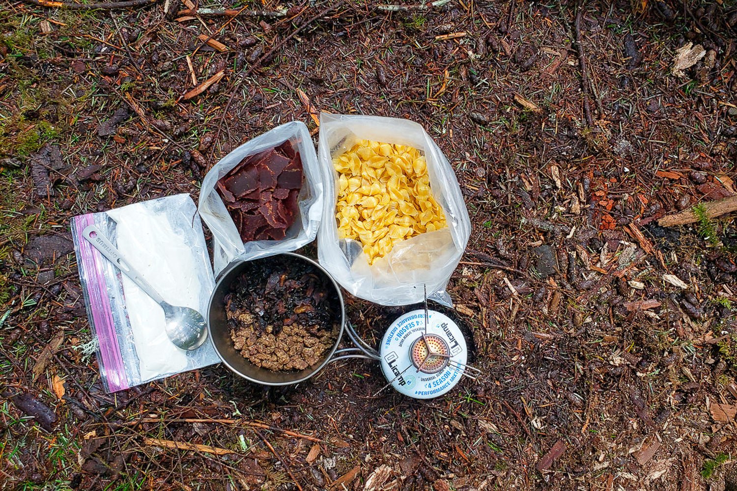 Top-down view of the dried components of a backpacking meal before it's cooked