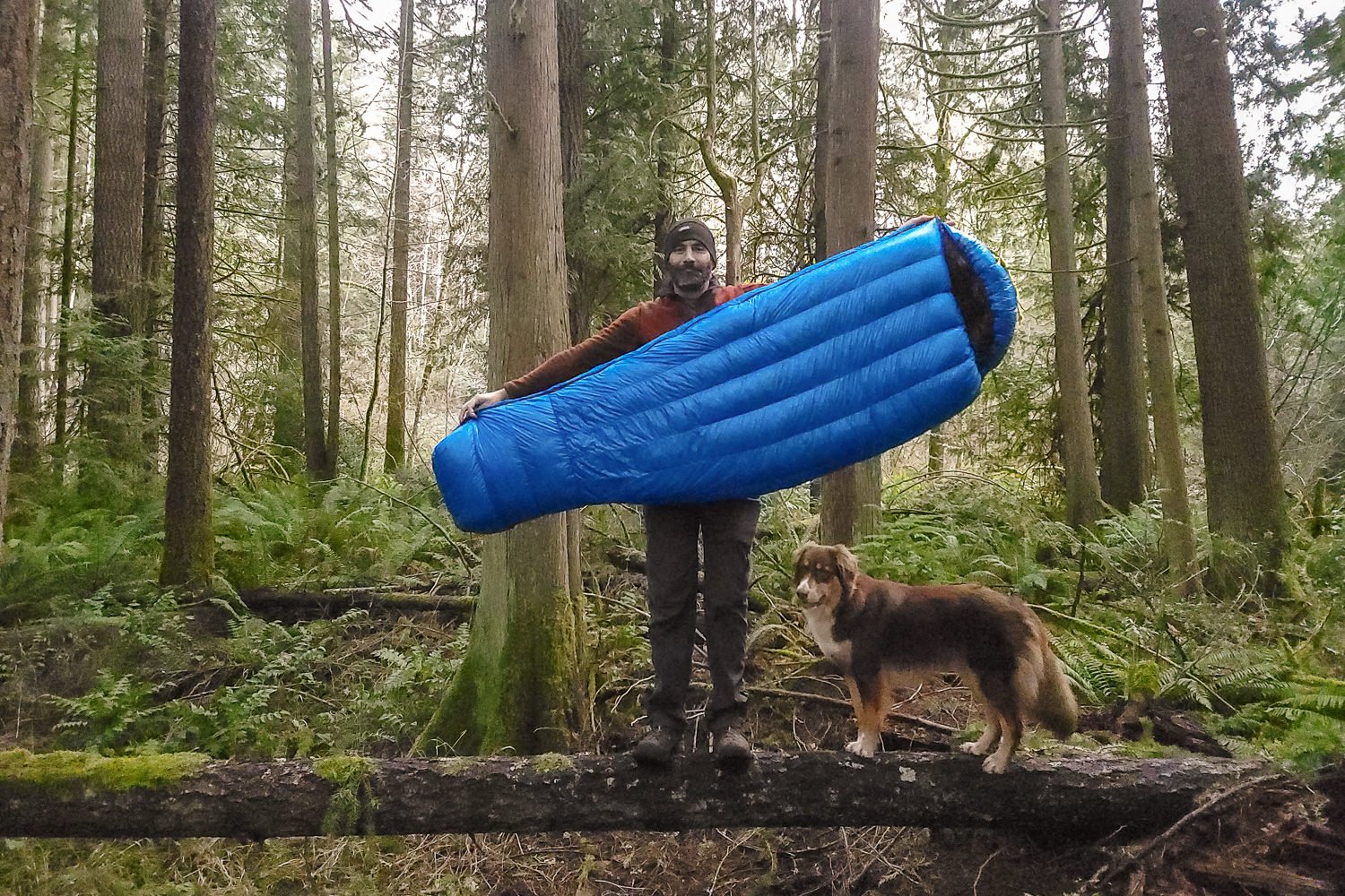 A hiker holding the Zpacks Mummy Sleeping Bag