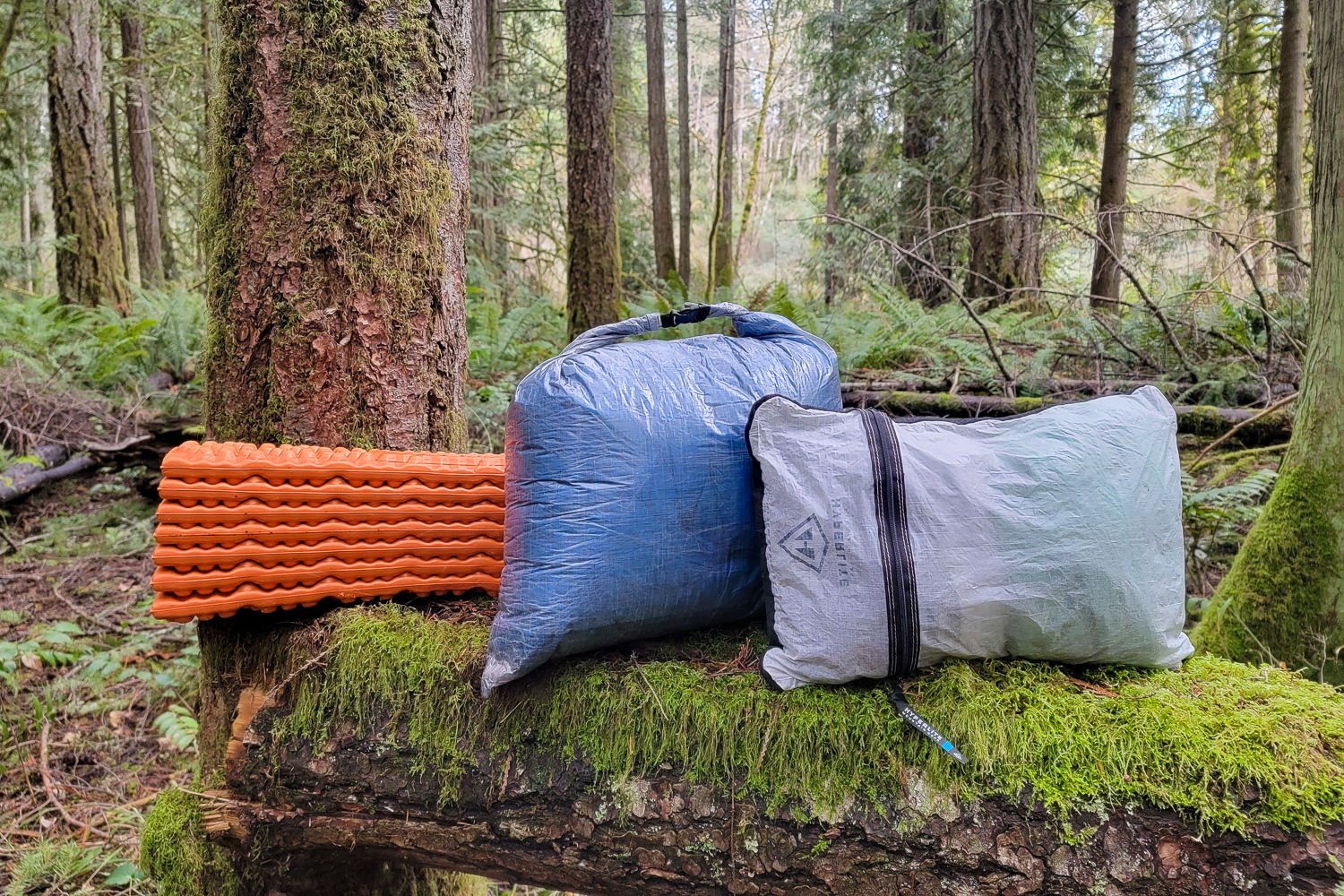 Closeup of the Zpacks Mummy Bag in its stuff sack with a backpacking pillow and sleeping pad