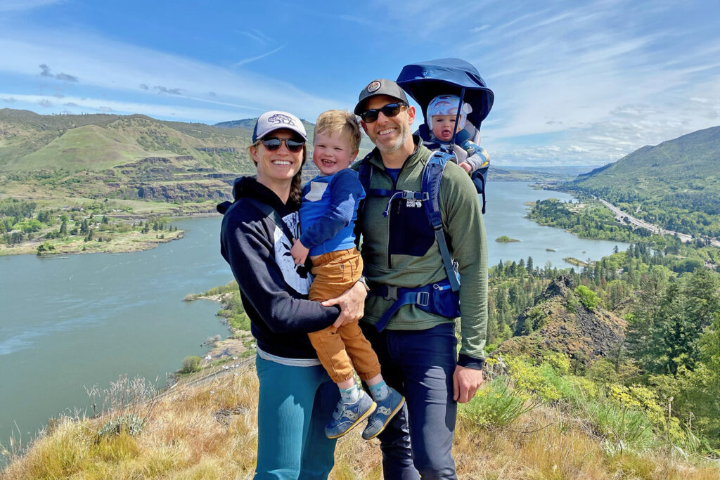 A family posing for a photo at a viewpoint in the Columbia River Gorge