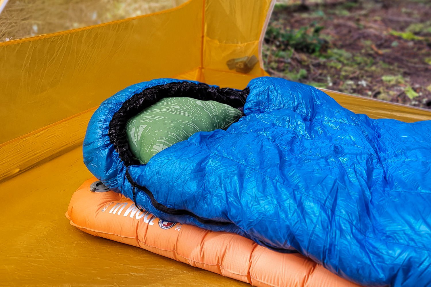 A sleeping pad with a pillow in the hood on top of the Big Agnes Zoom UL inside a tent
